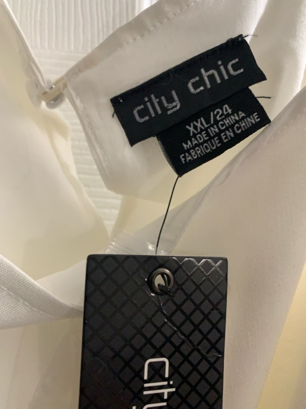 City Chic Ivory short play suit. Satin fabric feel. Lightweight fabric size 24.